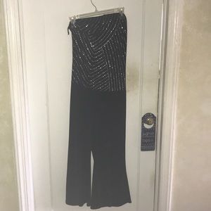 Strapless jumpsuit with sheer jacket